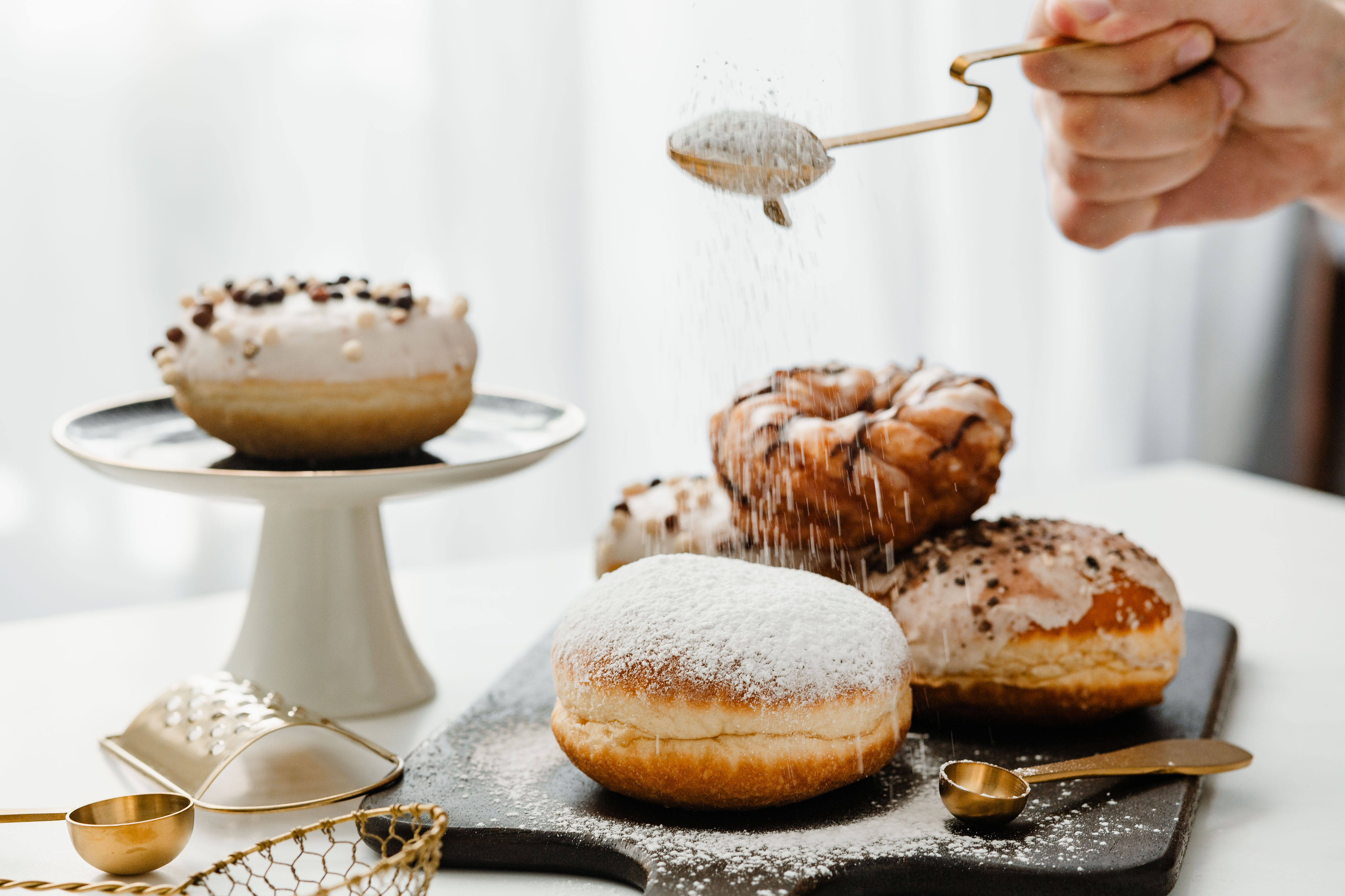 Donuts with chocolates and muffins indicating dreams and success.