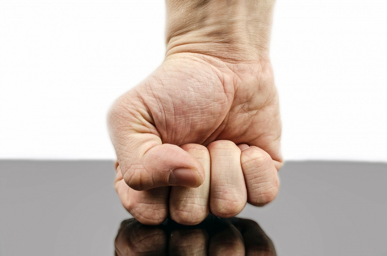 A closed fist making a hard punch